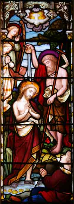 One of the panes of the stained glass window behind altar
